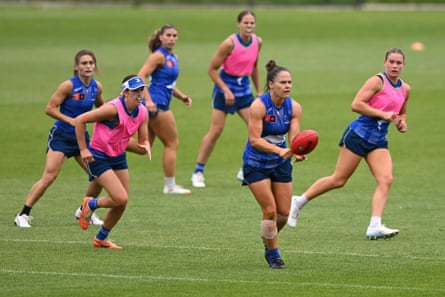 Emma Kearney handballs during a North Melbourne training session