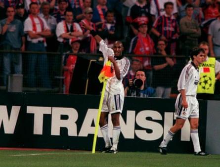 Nicolas Anelka clutches the corner flag after scoring