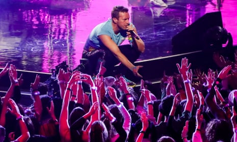 Coldplay performing in Italy this month – the band have led the way in reducing emissions.