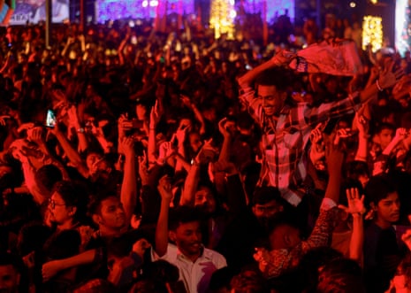 People dance during a party on New Year’s Eve in Mumbai.