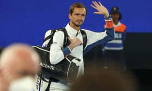 Daniil Medvedev waves to the crowd as he arrives to face Stefanos Tsitsipas.