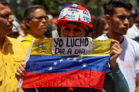 Opposition demonstrators are gathered during a protest against the government’s economic measures in Caracas.