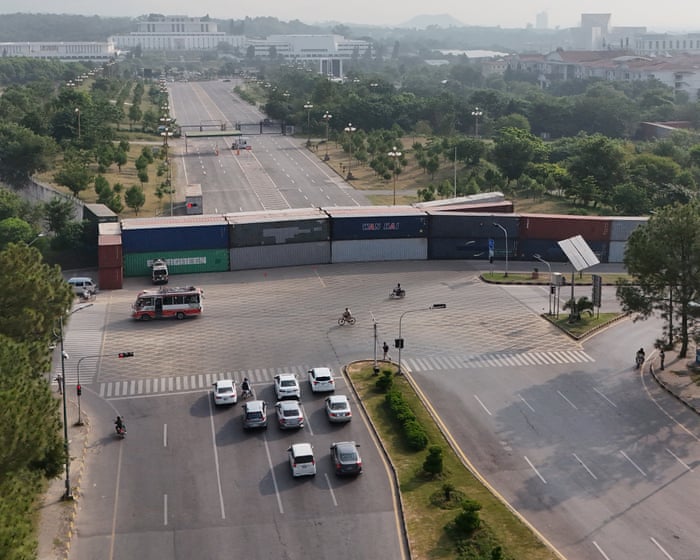 Pakistan locks down Islamabad as Imran Khan’s party vows to march on capital