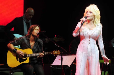 Keith Urban and Dolly Parton on stage.
