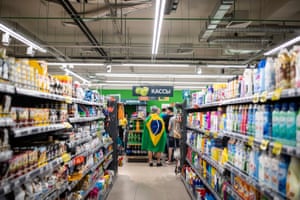 A Brazilian fan queues at a supermarket in Kazan prior to the quarter-final between Belgium and Brazil.