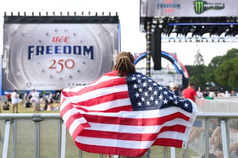 A fan looks on during the UFC Freedom 250 fan fest on Sunday at the Ellipse in Washington.