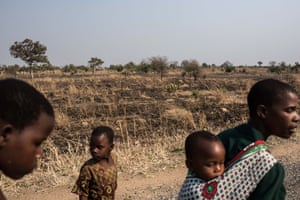 Members of the Majawa family walk to their church in the village of Mulele, which lies in one of the areas most affected by drought in Zomba, Malawi.