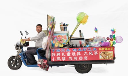 Toy vendor Xuxing with a Mu Ling motorbike in Shanghai, China