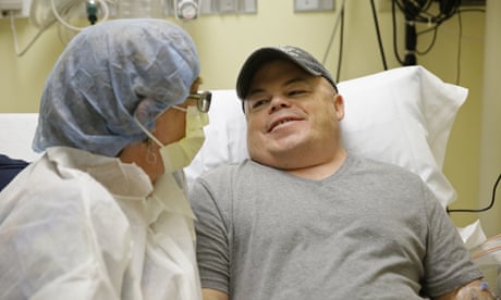 Brian Madeux, 44, sitting with his girlfriend Marcie Humphrey, waits to receive the first human gene editing therapy for NPS, at the UCSF Benioff Children's Hospital in Oakland, Calif., on Monday, Nov. 6, 2017. Through an IV, Madeux will receive billions of copies of a corrective gene and a genetic tool to cut his DNA in a precise spot. "It's kind of humbling" to be the first to test this, said Madeux, who has a metabolic disease called Hunter syndrome. (AP Photo/Eric Risberg)