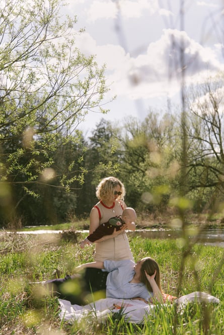 The family connected a broad connected writer adjacent a river, Rosa opinionated up holding Mara pinch her hands underneath baby’s stomach, and Leah lying connected a broad looking up astatine them