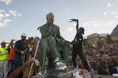 Students attack the defaced statue of Cecil John Rhodes at the University of Cape Town on 9 April.