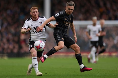 Leandro Trossard duels for the ball with Fulham's Harrison Reed.