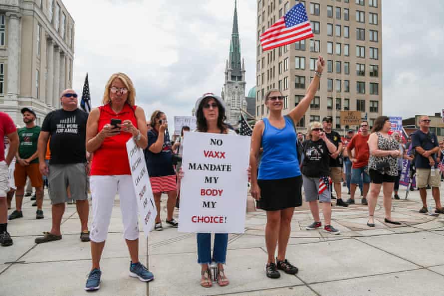 A protester holds a placard during the anti-vaccine, anti-mask mandate Rally for Freedom on the steps of Pennsylvania state capitol in Harrisburg on 29 August.