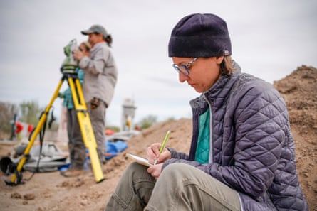 Dr Kate Spradley takes notes while overseeing Texas State University graduate students exhuming bodies at the La Grulla cemetery.