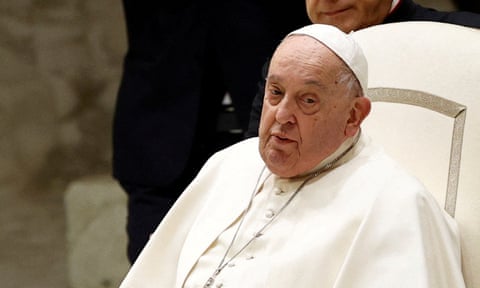 Pope Francis sitting in white chair