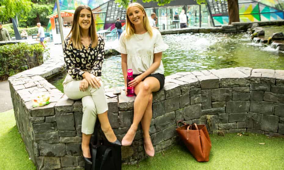 Ines Teixeira (left) and Holly White take a lunch break together in Canary Wharf