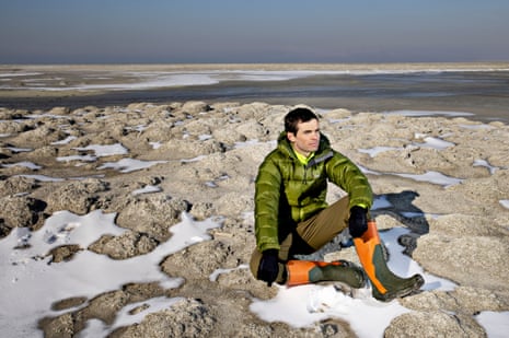 Ben Abbott on a mound of bleached and exposed microbialites at the Great Salt Lake in Utah.
