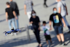 A police drone fitted with a megaphone speaker patrols over Taksim Square in Istanbul searching for people not wearing face masks.