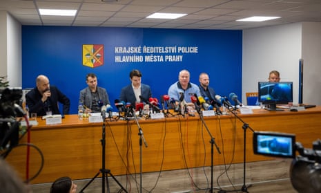 Prague's Police chief Petr Matejcek (4th L) and others address a press conference on December 22, 2023 in Prague to inform about a deadly mass shooting at a university the day before.