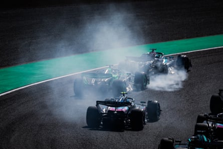 George Russell (top) sends smoke up from his Mercedes tyres on his way to a seventh place finish at the Japanese GP.