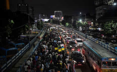 Protesters fill a street as they walk