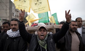 Mourners carry the body of Israa Abu Khussa, six, during her funeral in Beit Lahiya, Gaza