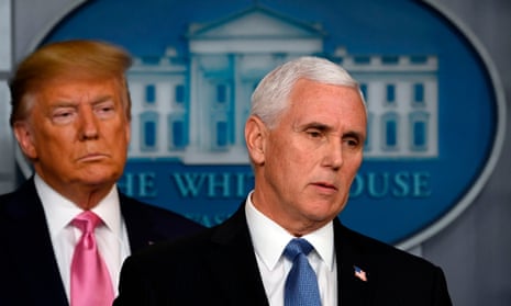Donald Trump stands behind Mike Pence as he speaks at a news conference at the White House in Washington DC, on 26 February. 
