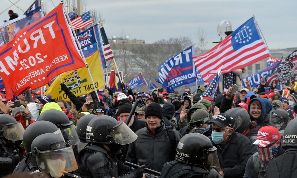 Trump supporters clash with police and security forces as they try to storm the US Capitol on 6 January 2021.