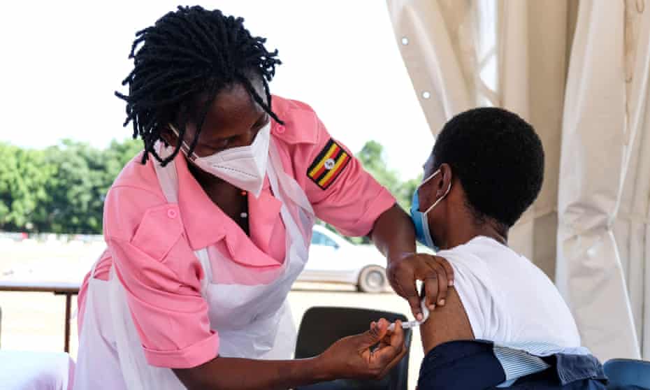 A nurse injects a Covid-19 vaccine at Kololo Ceremonial Grounds in Kampala, Uganda, on 31 May.