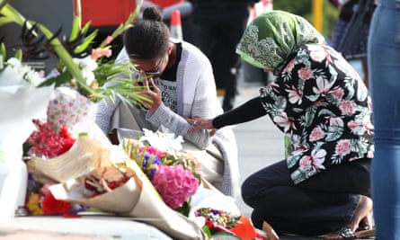 Locals lay flowers in tribute to those killed and injured at Deans Avenue near Al Noor Mosque