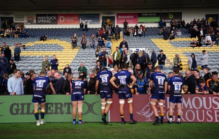 Worcester Warriors players talk to supporters after the final whistle of their game against Newcastle