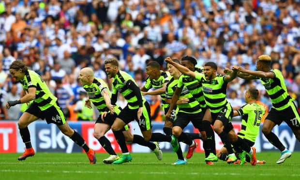 Huddersfield Town celebrate victory in their Premier League promotion play-off against Reading in May.