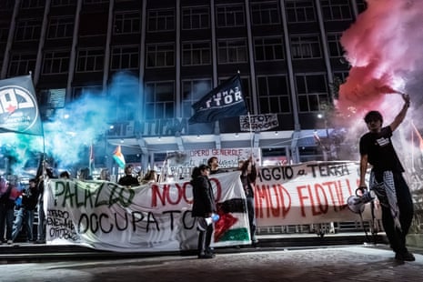 People take part in a demonstration in support of the Palestinian people and the Global Sumud Flotilla in Turin, Italy.
