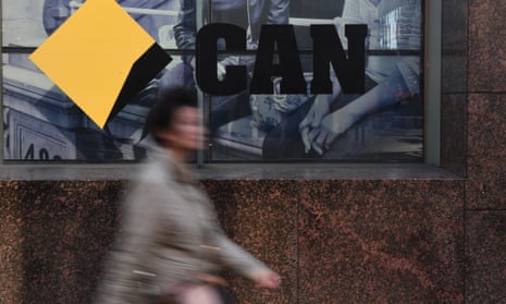 CBD workers walk past the a Commonwealth Bank of Australia branch in Sydney.