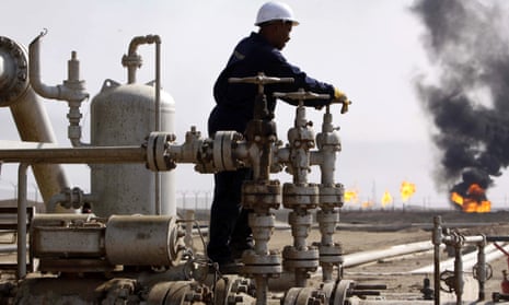 A worker operates valves at the Rumaila oil refinery, near Basra, Iraq. 