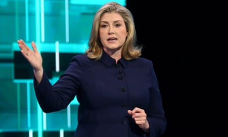 Penny Mordaunt raises a hand while speaking during an ITV election debate