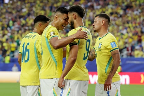 Matheus Cunha celebrates scoring their third goal with Casemiro and Bruno Guimaraes