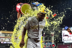 Teammates shower Andruw Monasterio with a yellow liquid