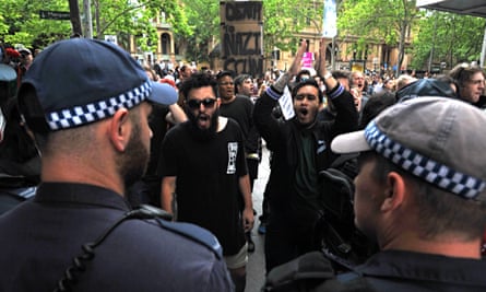 NSW Police hold a containment line during an opposition rally to counter the Reclaim Australia Rally at Martin Place in Sydney, Sunday, Nov. 22, 2015.