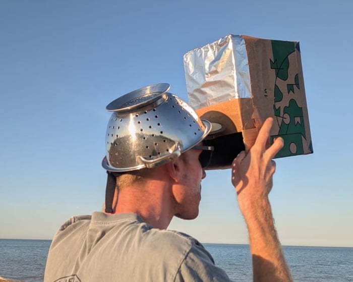 ‘The colander worked best!’ Guardian readers share their experience of the solar eclipse