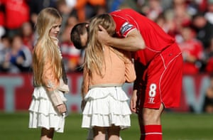 Steven Gerrard kisses one of his daughters before his final game at Anfield
