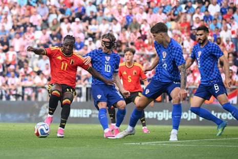 Jeremy Doku (left) causing problems for Luka Modric and his teammates during Belgium’s friendly against Croatia.