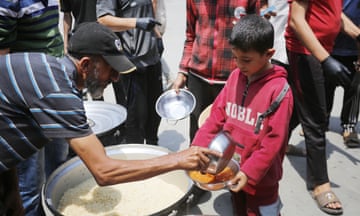 A charity hands out food in Gaza