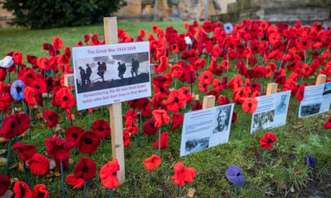 Knitted poppies are displayed around the war memorial outside the Christ church in Great Ayton, North Yorkshire to commemorate Armistice Day.
