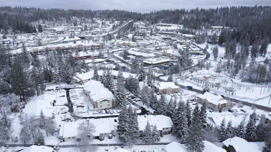 Extremists see opportunity as fury over Covid rules erupts in rural California | California 1 scene of houses in Nevada County in the snow