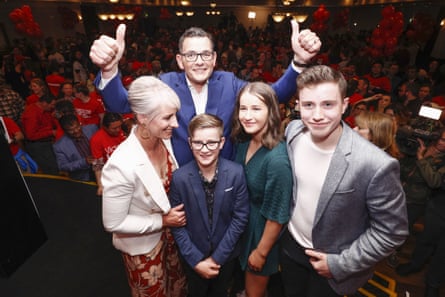 Daniel Andrews poses for a photo with his family.