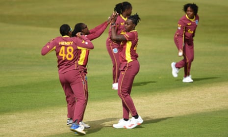 Shamilia Connell of the West Indies celebrates with teammates after dismissing Tammy Beaumont of England.