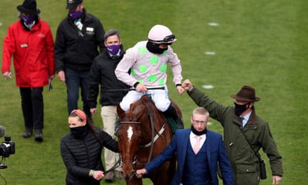 Willie Mullins (bottom right) celebrates Cheltenham victory with Paul Townend on Monkfish.