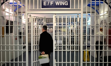 A man enters a prison wing