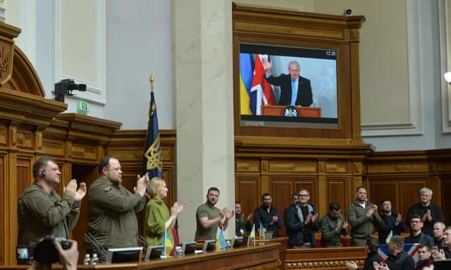President Volodymyr Zelenskiy applauds Boris Johnson during a session at Ukraine’s parliament in Kyiv.